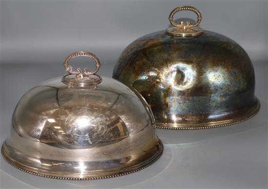 Two Edwardian silver plated meat dish covers, largest 30cm